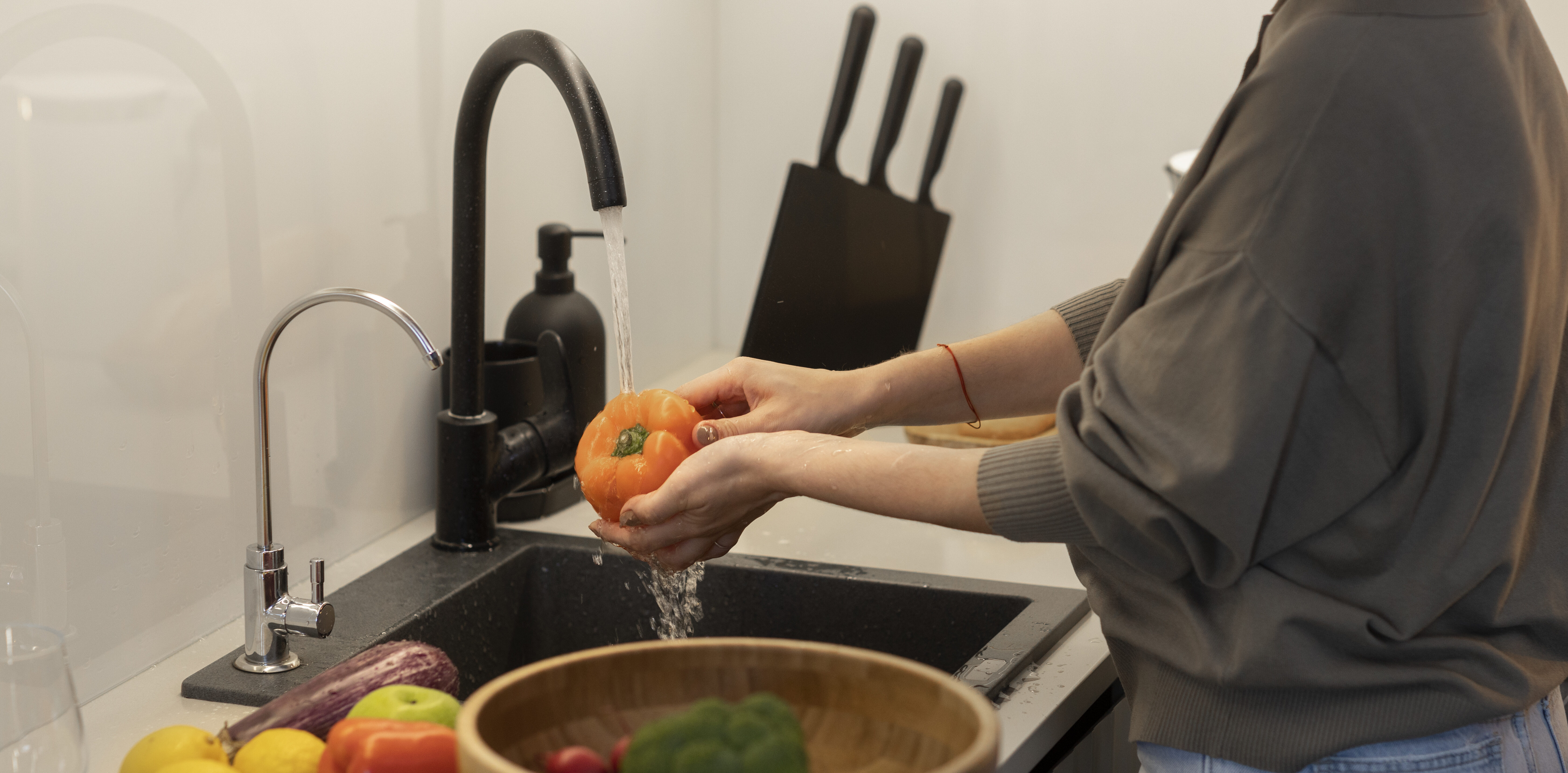 woman-washing-vegetables-side-view